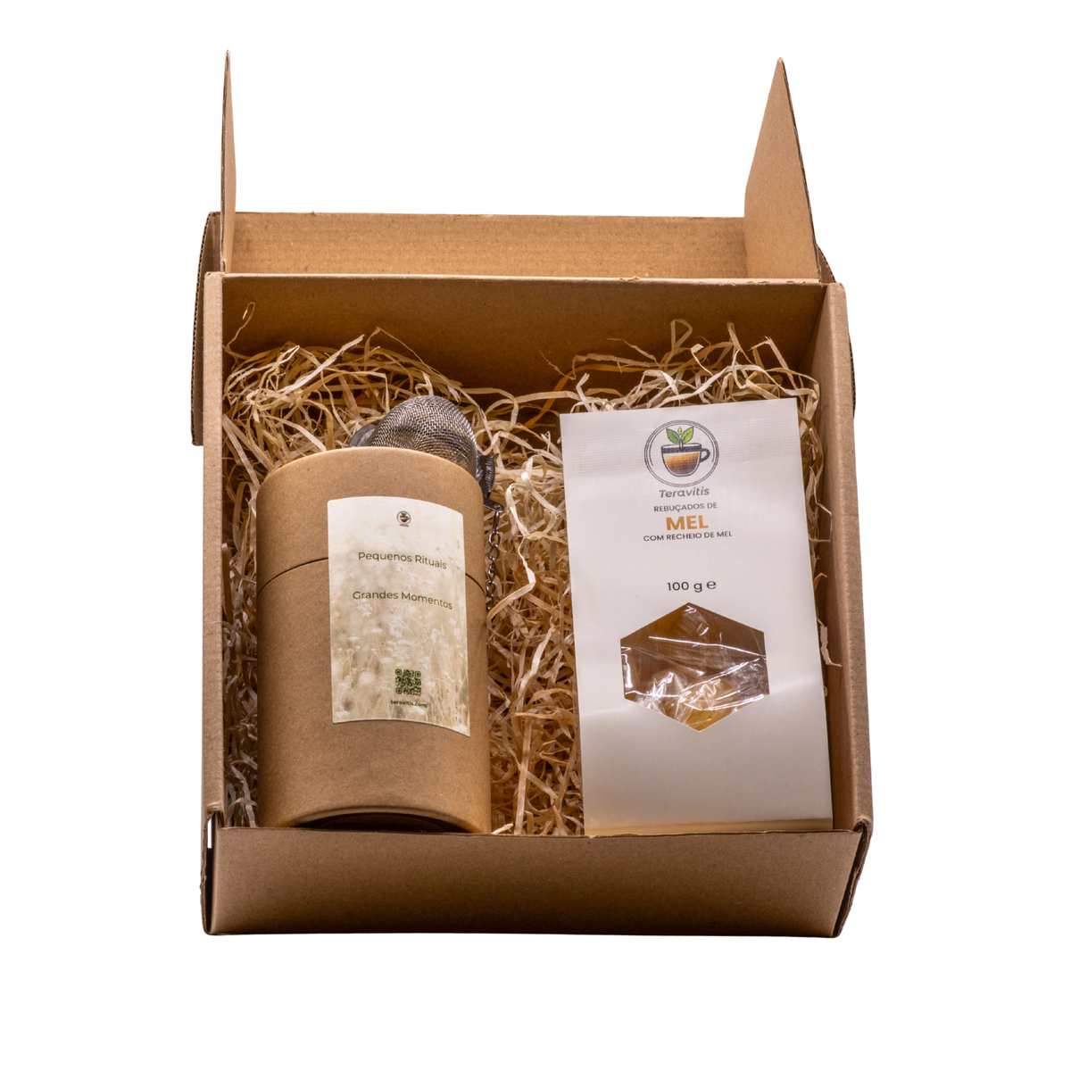Caixa presente Teravitis aberta com Infusão Rooibos e Canela, infusor e rebuçados de mel em palha de madeira